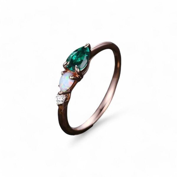 0.3 CT Pear cut Emerald Three Stone Ring - GEMPARA