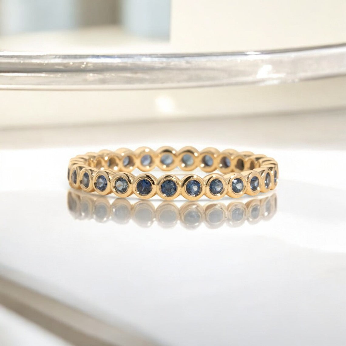 Round Sapphire Bezel Eternity Ring