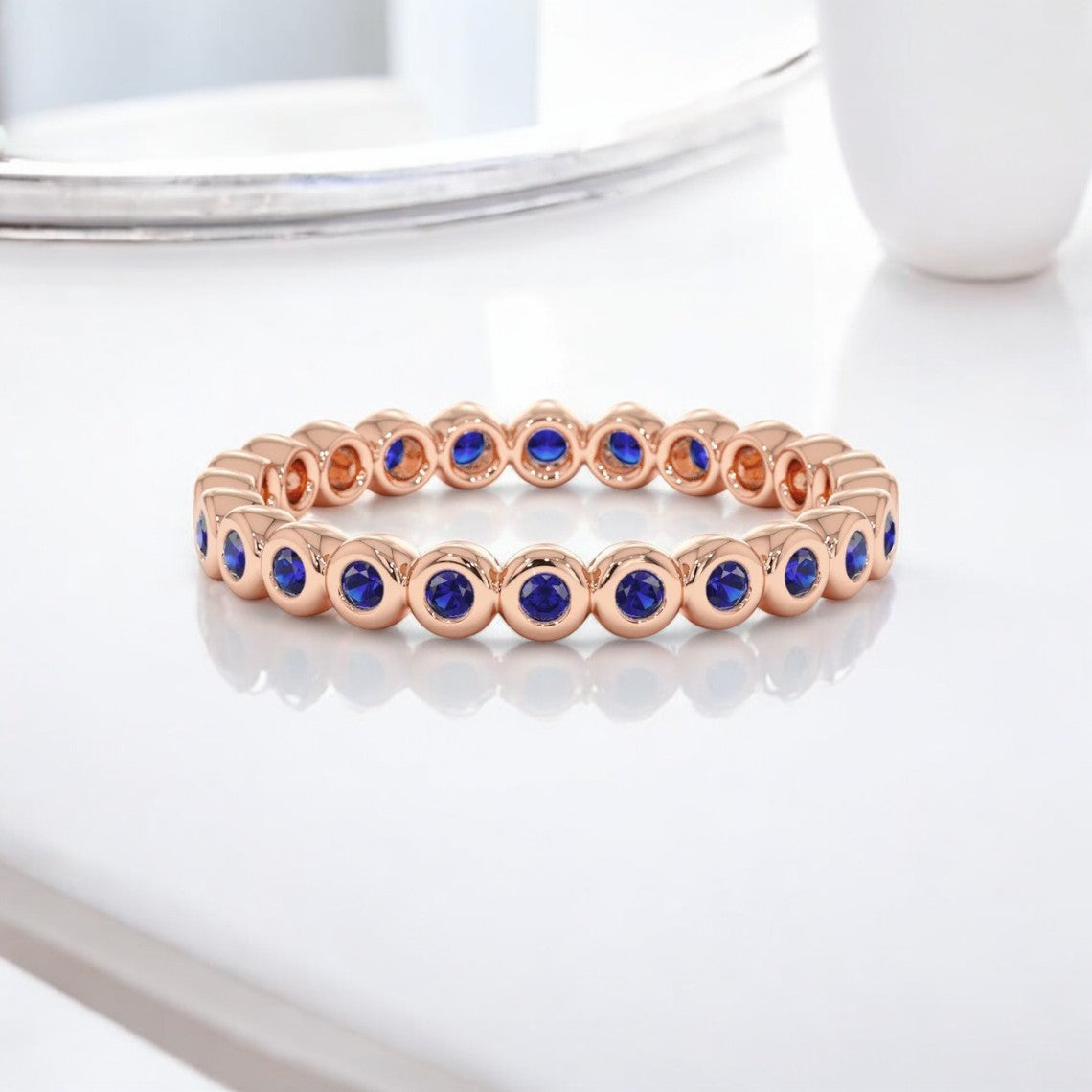 Round Lab Blue Sapphire Bezel Eternity Ring - GEMPARA