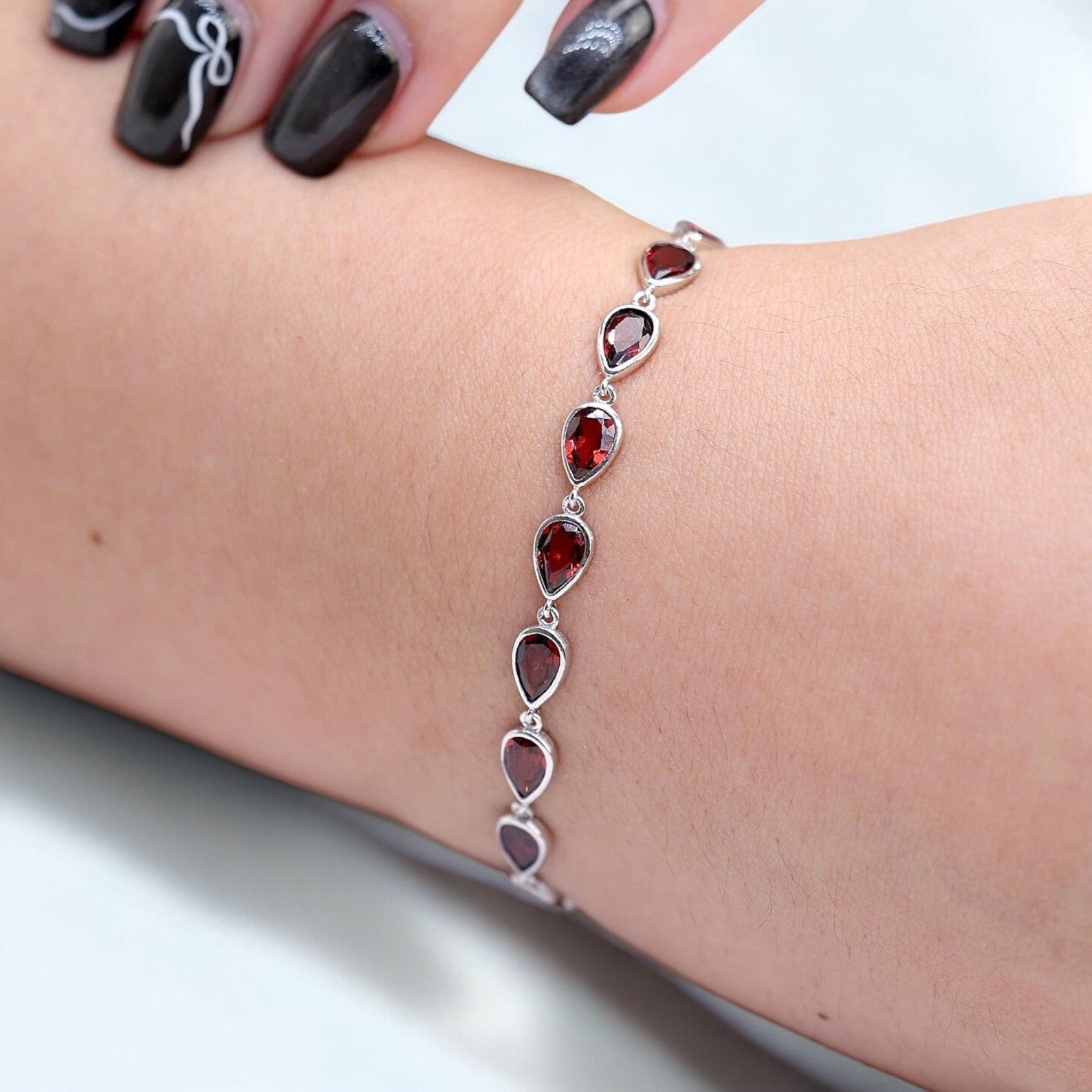 Silver Pear-Cut Garnet Tennis Bracelet - GEMPARA